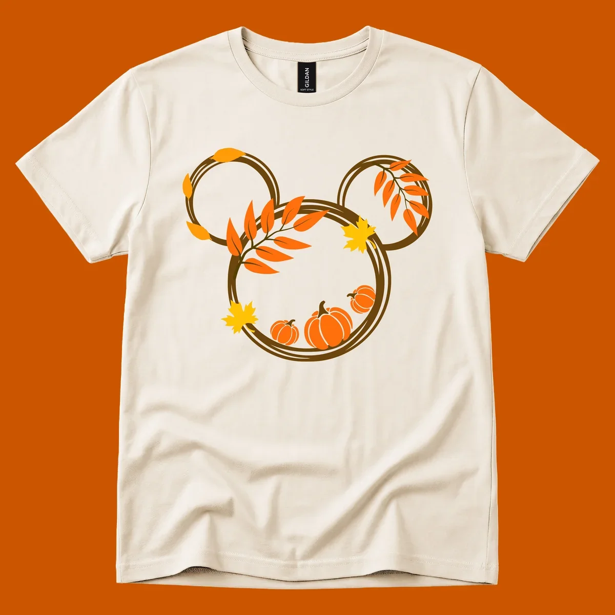 Mickey autumn leaves and pumpkins graphic with branches and pumpkins.