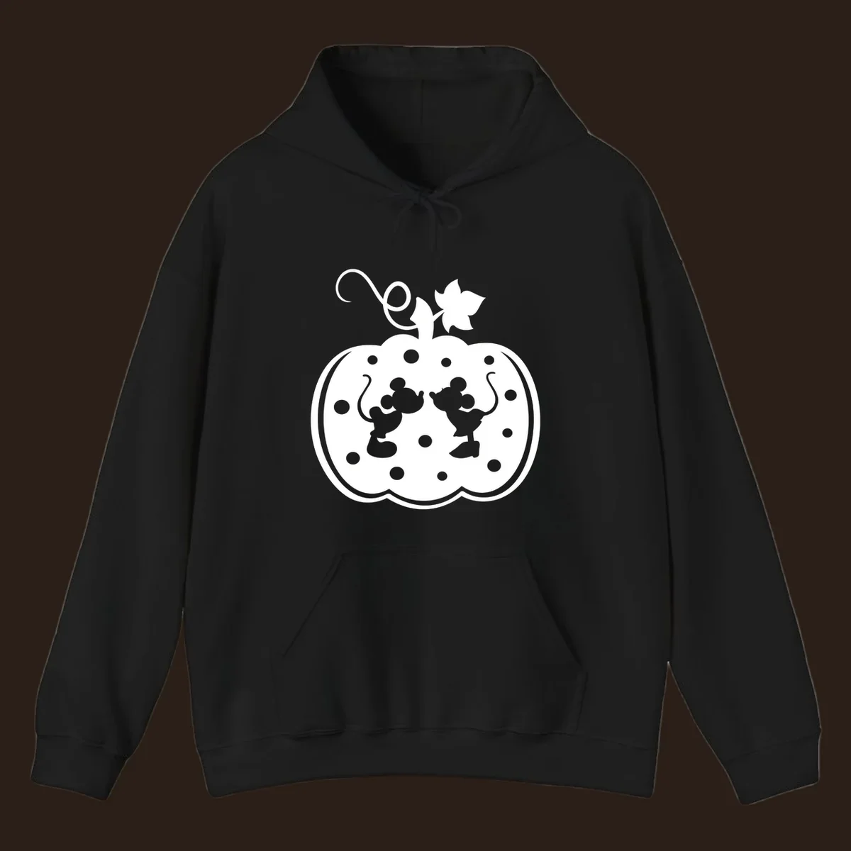 Mickey and Minnie Mouse kissing inside a pumpkin silhouette, with polka dots. Mickey-Minnie-pumpkin.