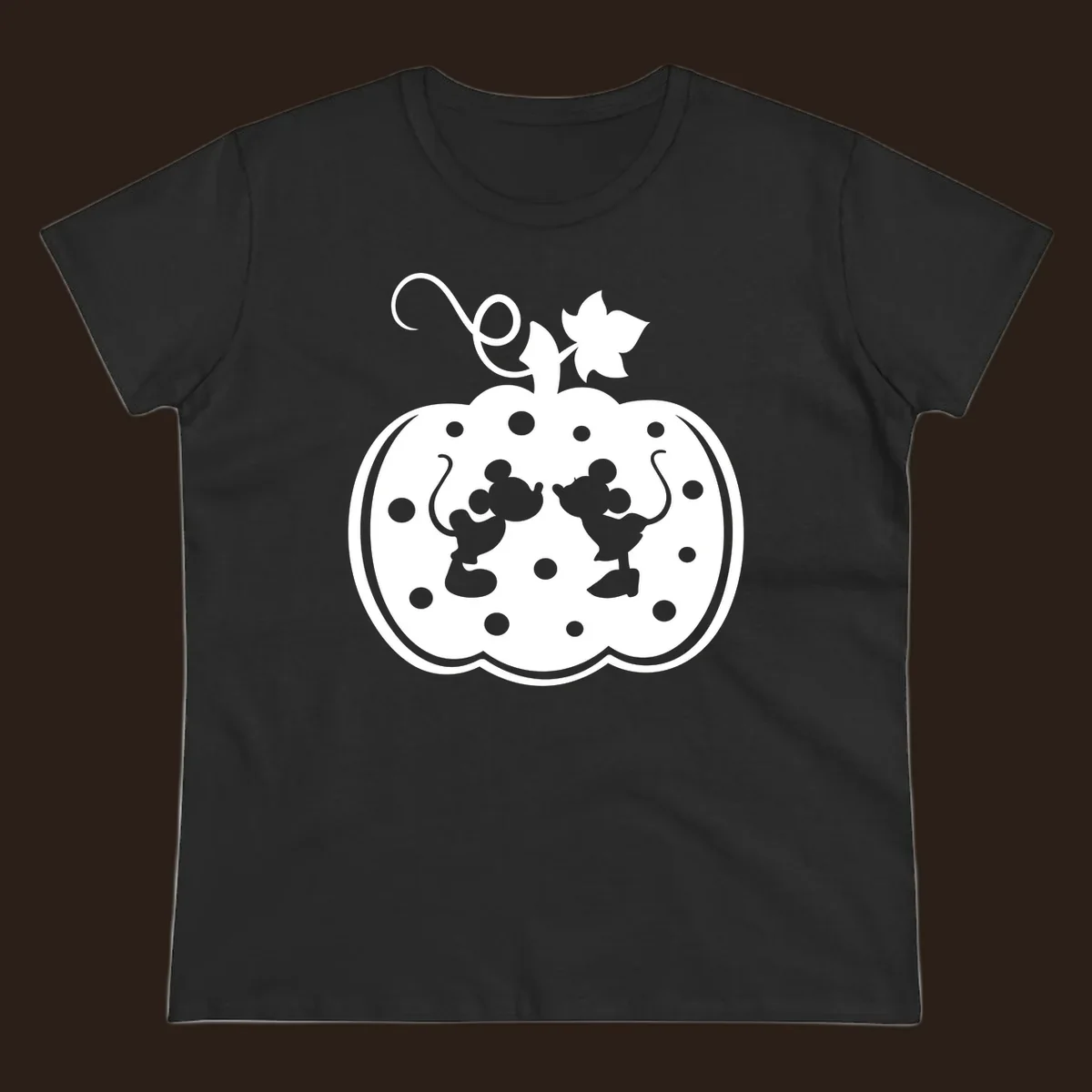 Mickey and Minnie Mouse kissing inside a pumpkin silhouette, with polka dots. Mickey-Minnie-pumpkin.