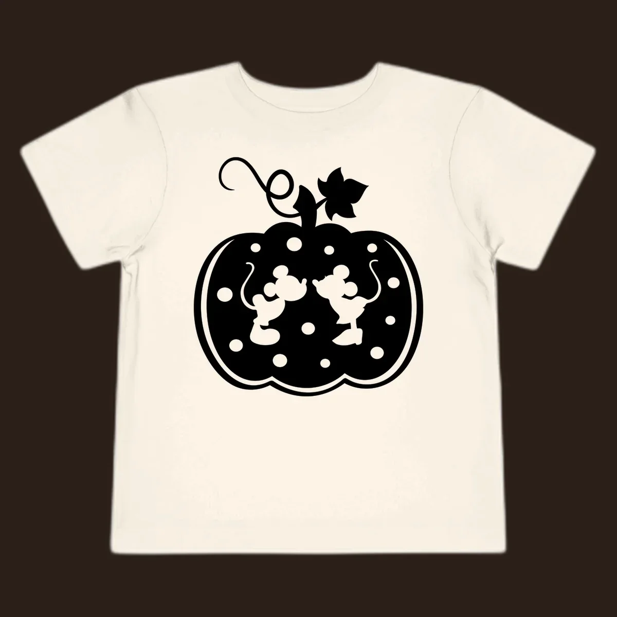 Mickey and Minnie Mouse kissing inside a pumpkin silhouette, with polka dots. Mickey-Minnie-pumpkin.