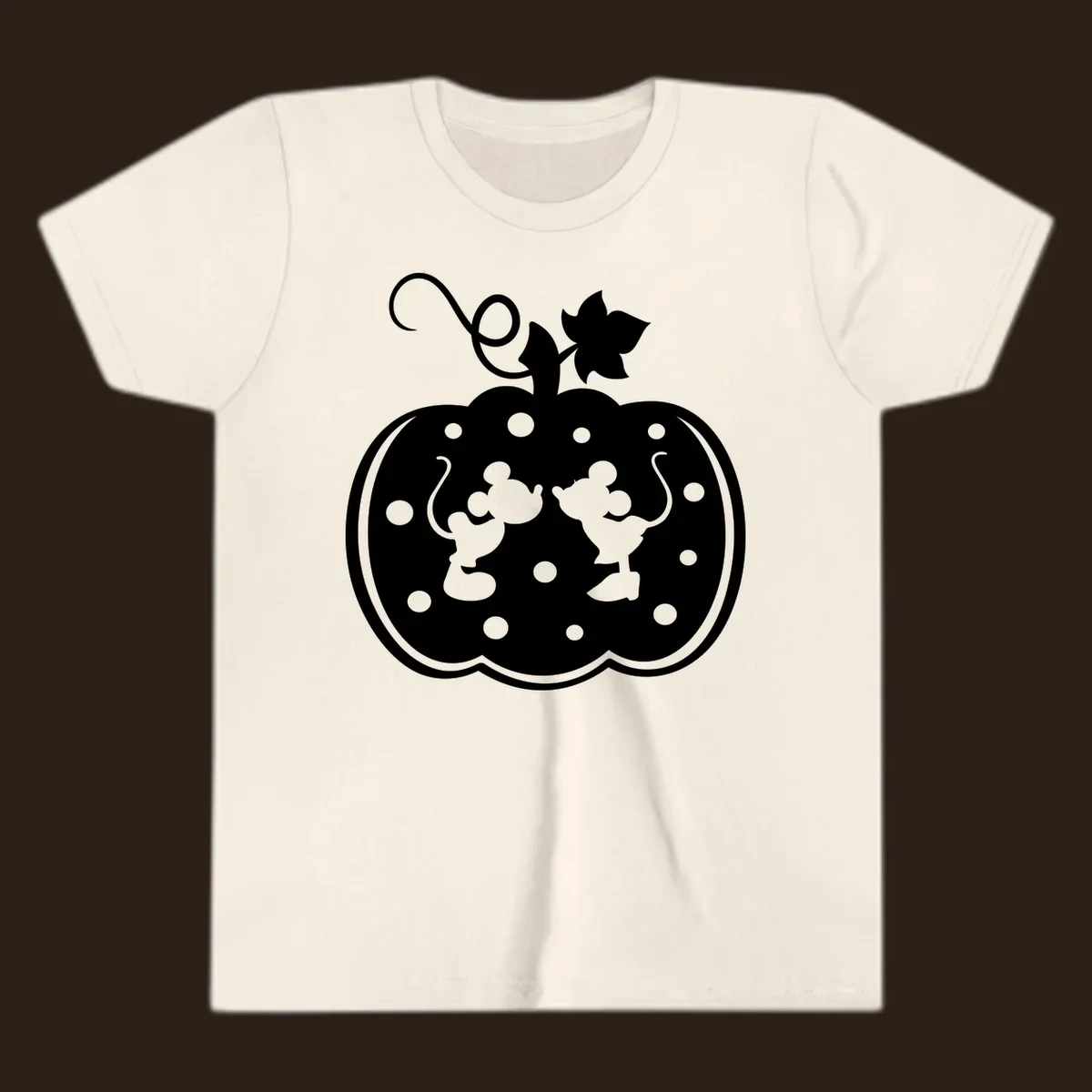 Mickey and Minnie Mouse kissing inside a pumpkin silhouette, with polka dots. Mickey-Minnie-pumpkin.