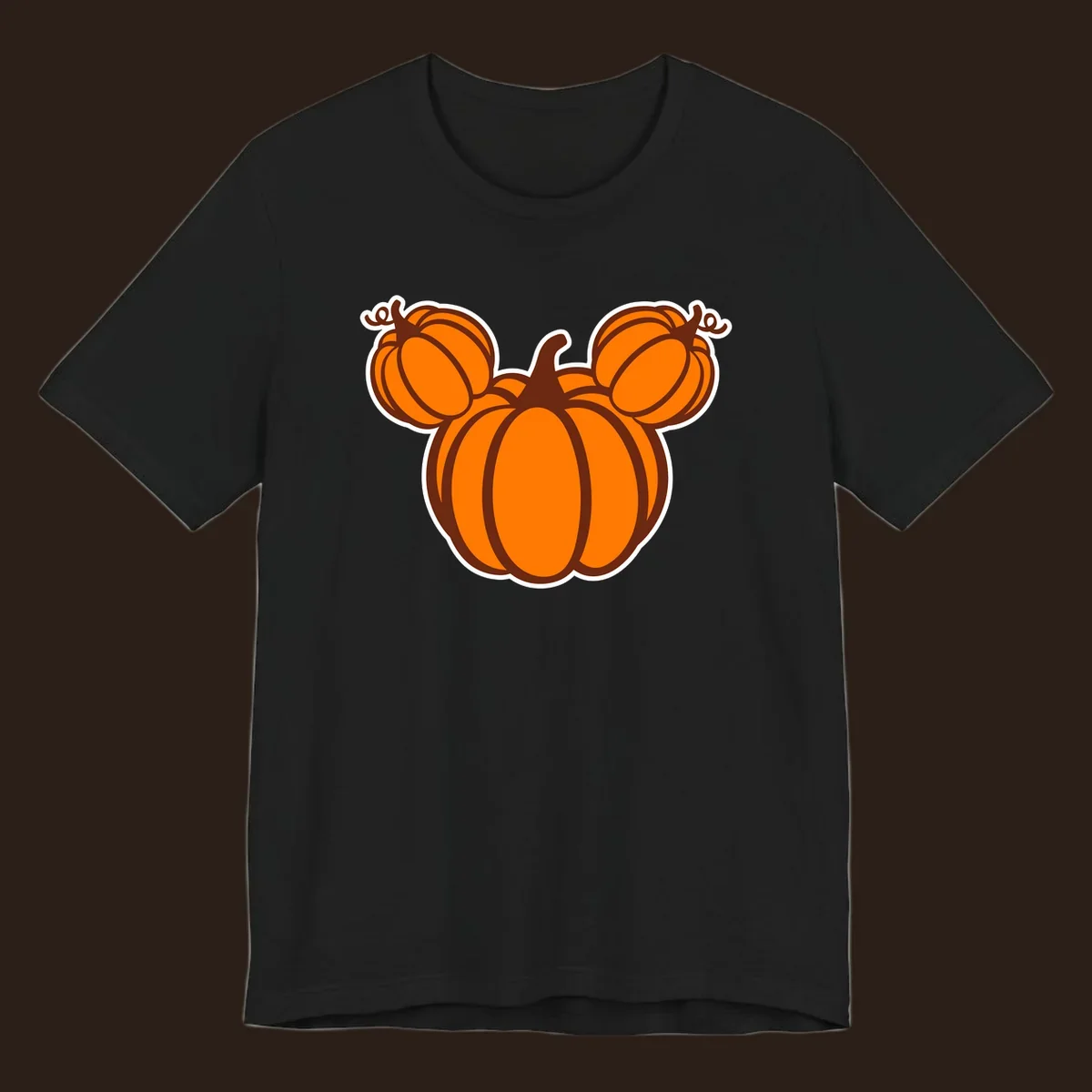 Mickey pumpkin head graphic with orange pumpkins and brown outlines.