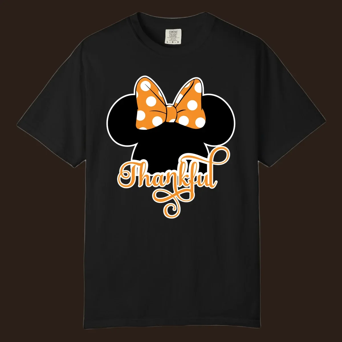 Minnie Mouse ears with orange polka dot bow and "Thankful" text, perfect for Thanksgiving.
