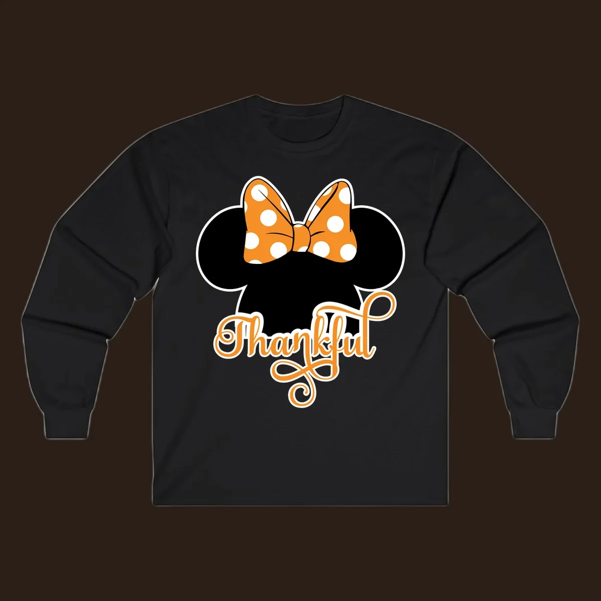 Minnie Mouse ears with orange polka dot bow and "Thankful" text, perfect for Thanksgiving.