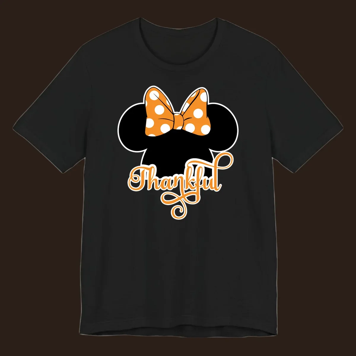Minnie Mouse ears with orange polka dot bow and "Thankful" text, perfect for Thanksgiving.