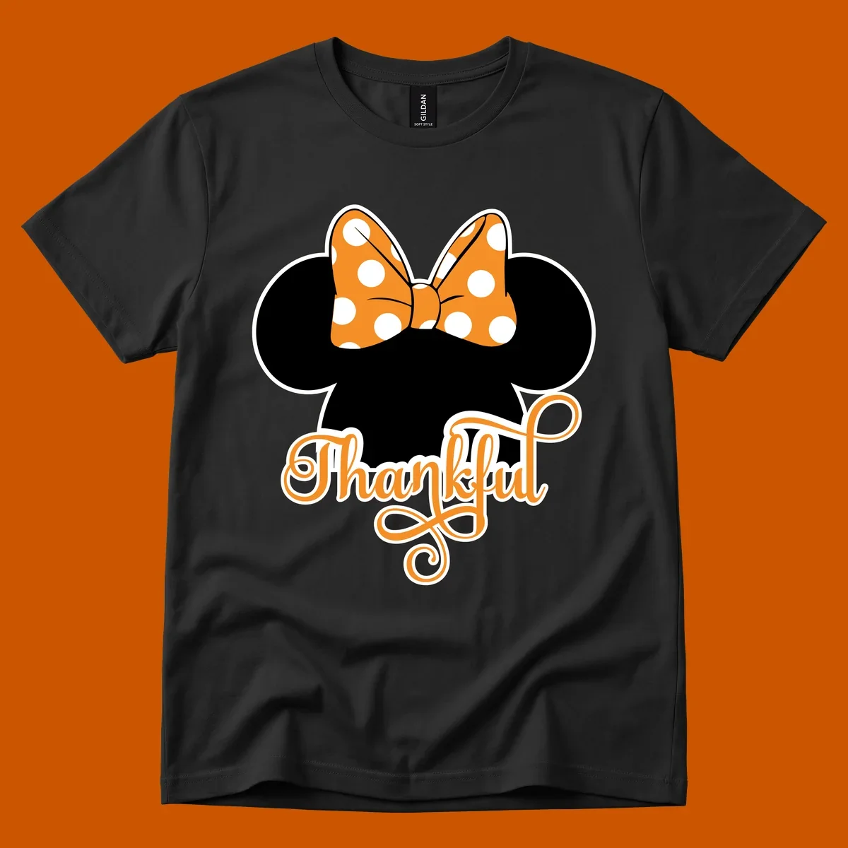 Minnie Mouse ears with orange polka dot bow and "Thankful" text, perfect for Thanksgiving.