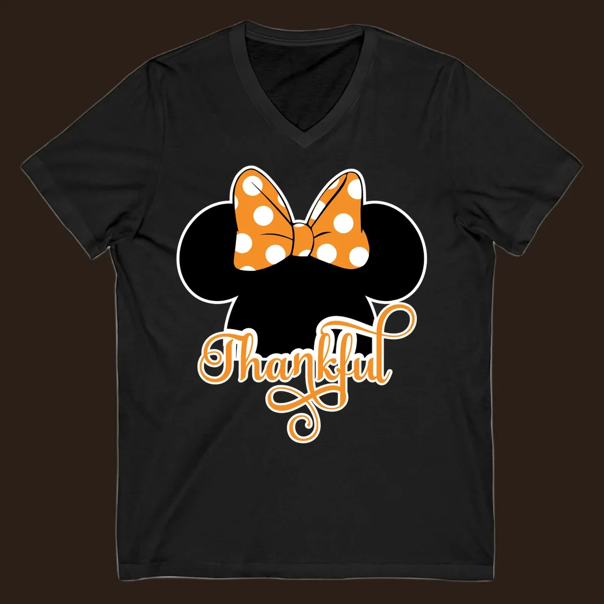 Minnie Mouse ears with orange polka dot bow and "Thankful" text, perfect for Thanksgiving.
