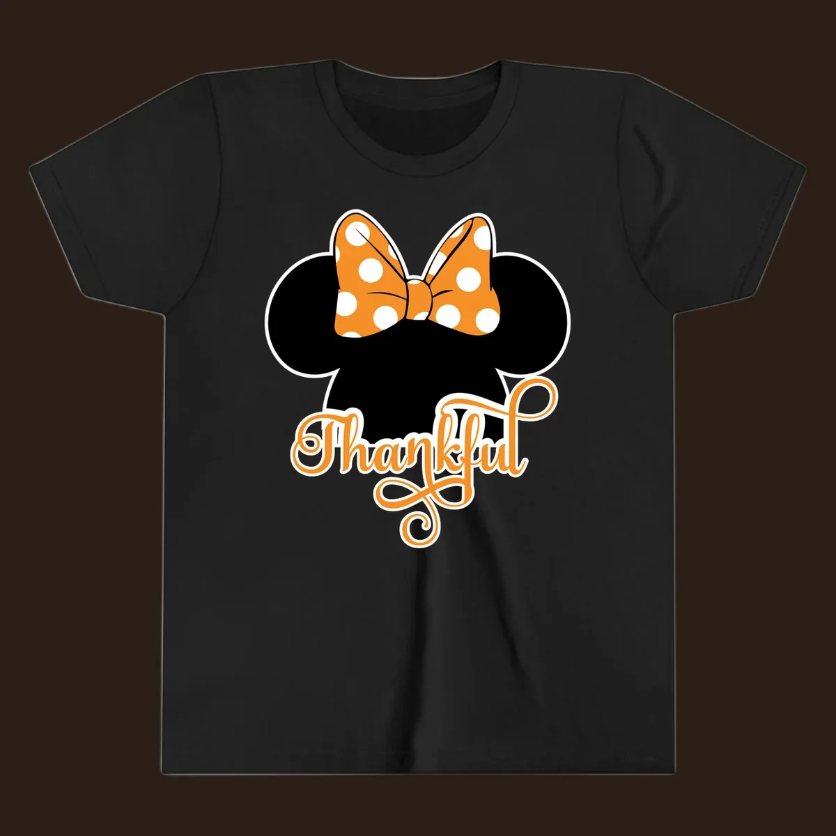 Minnie Mouse ears with orange polka dot bow and "Thankful" text, perfect for Thanksgiving.