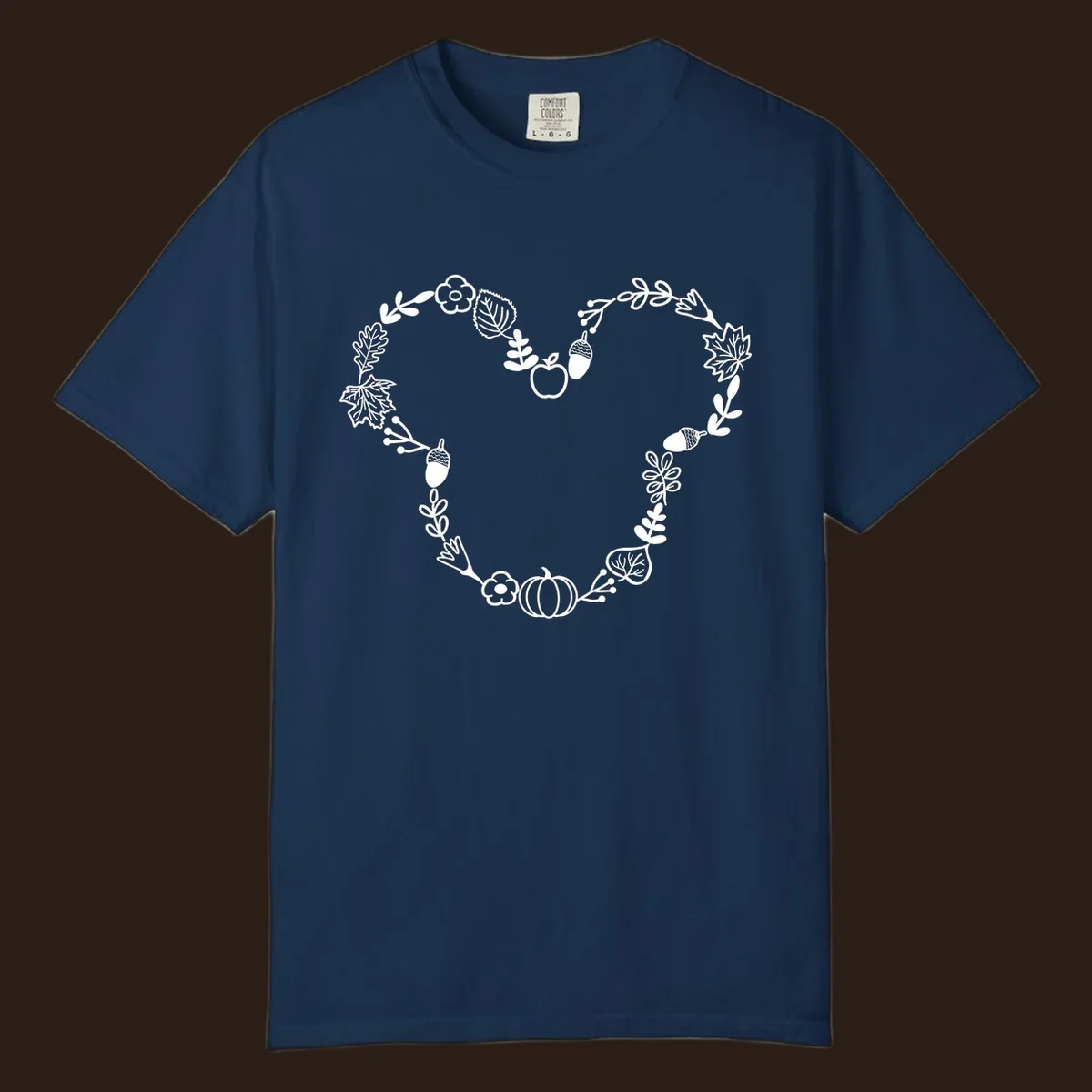 Heart shaped autumn wreath with leaves, acorns, pumpkin, and flowers. Outline design.