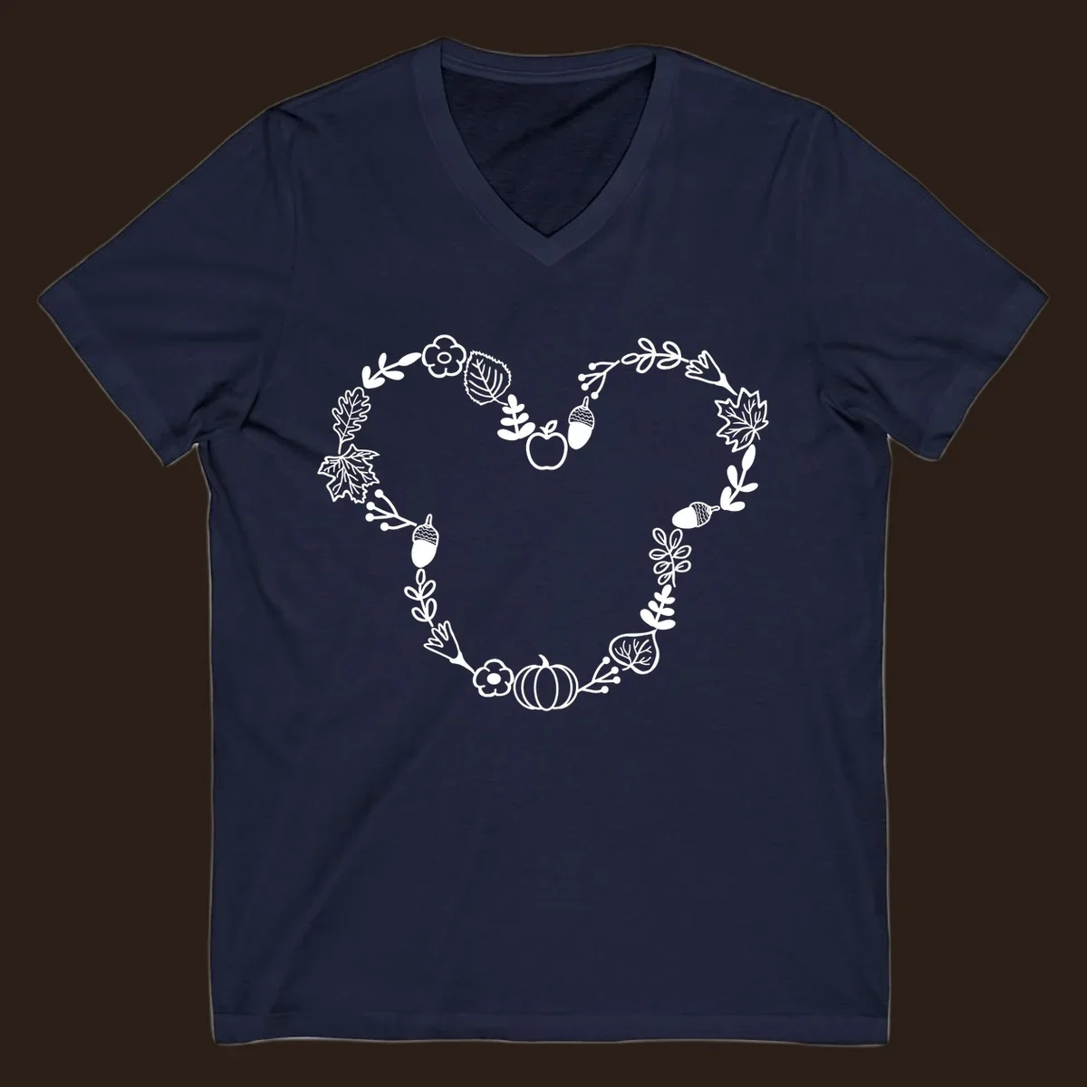 Heart shaped autumn wreath with leaves, acorns, pumpkin, and flowers. Outline design.