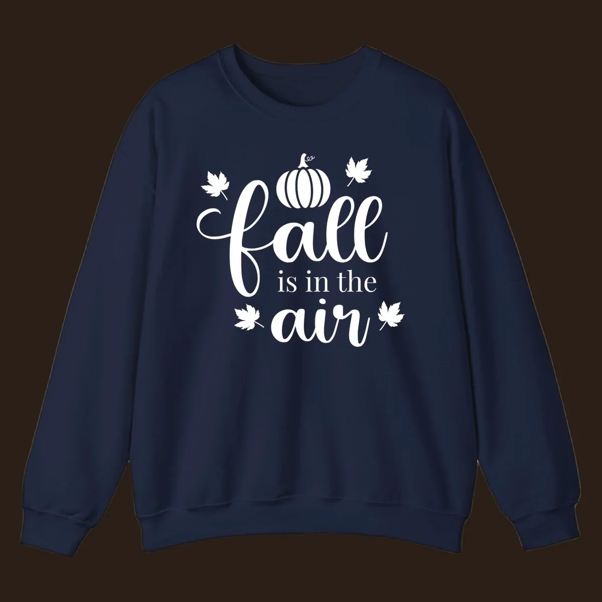 Fall is in the air phrase with pumpkin and maple leaves graphic.