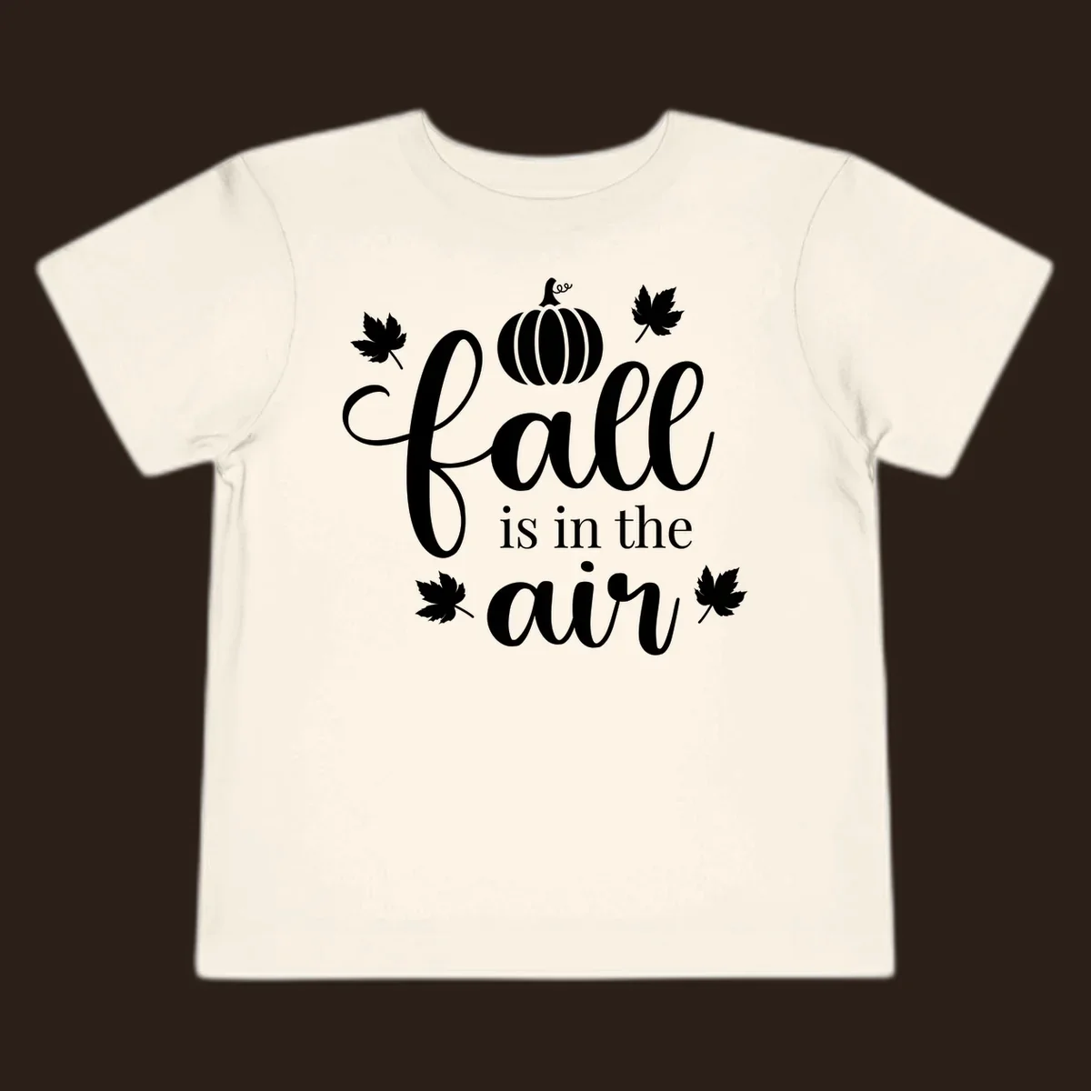 Fall is in the air phrase with pumpkin and maple leaves graphic.