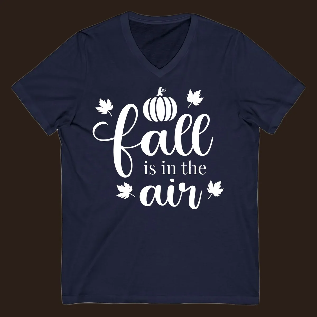 Fall is in the air phrase with pumpkin and maple leaves graphic.