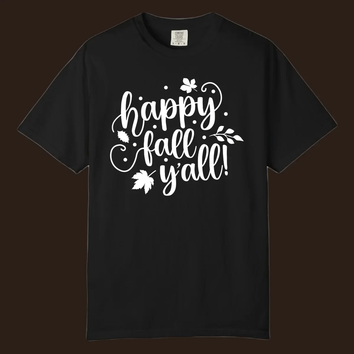 Happy Fall Y'all script design with maple leaves and swirls.