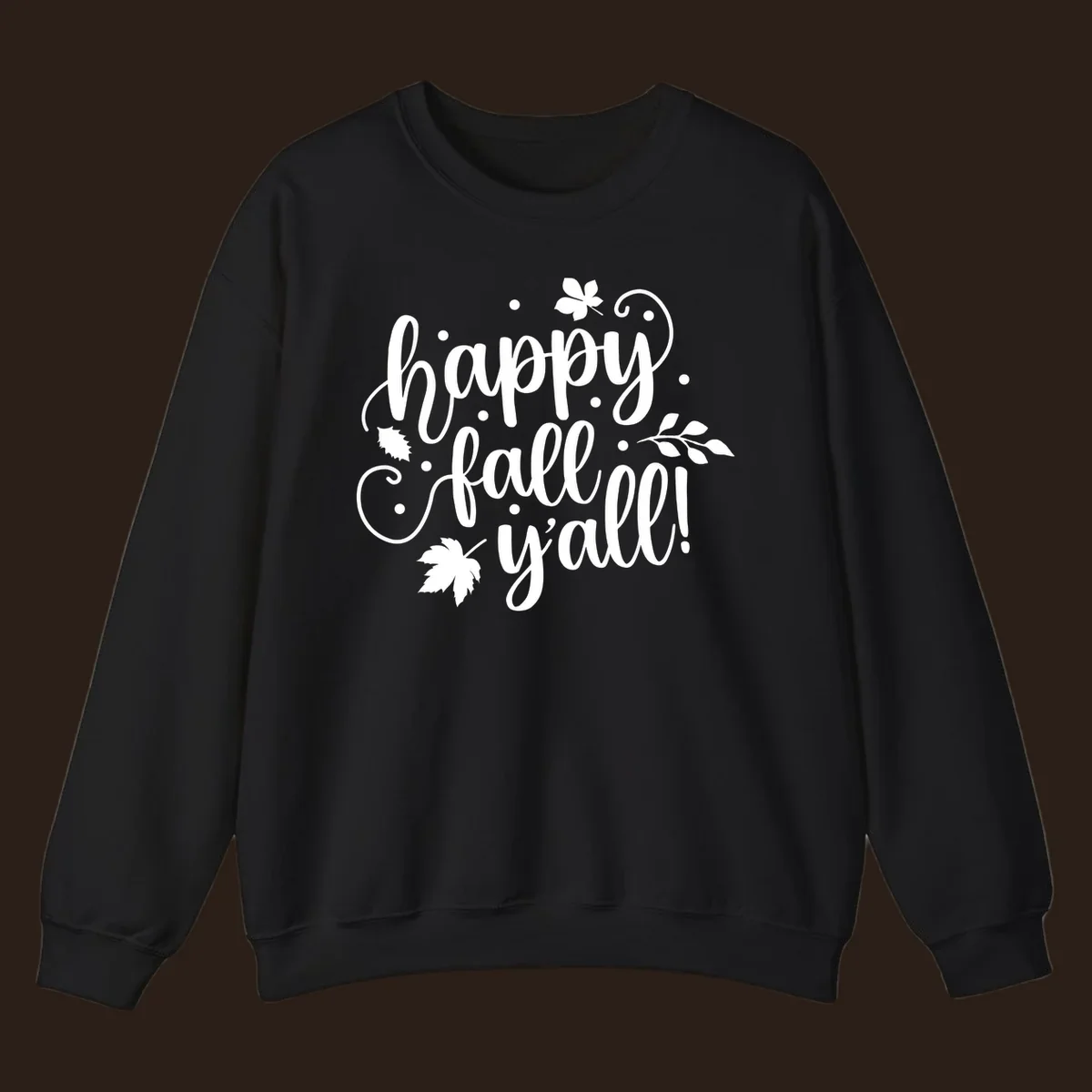Happy Fall Y'all script design with maple leaves and swirls.