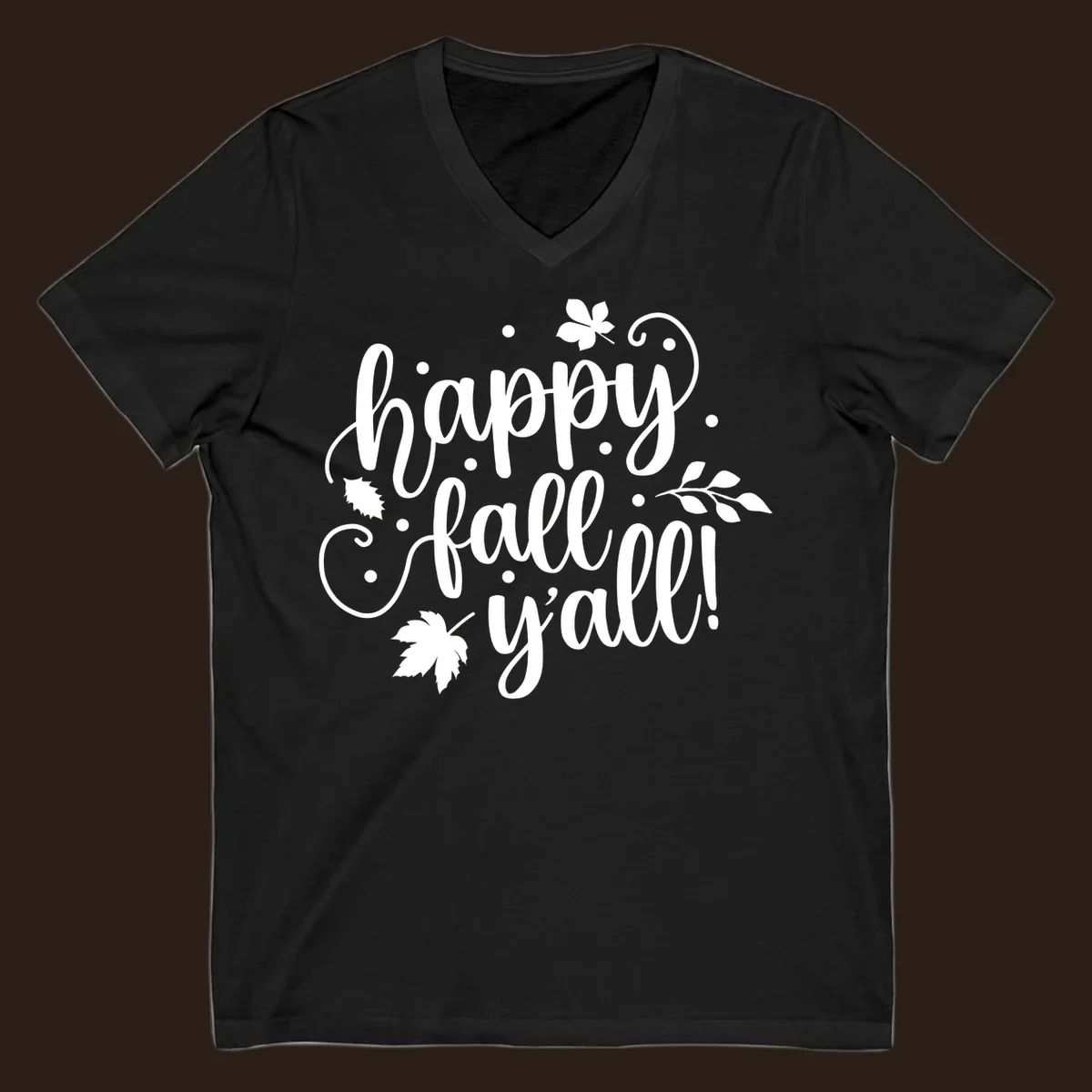 Happy Fall Y'all script design with maple leaves and swirls.