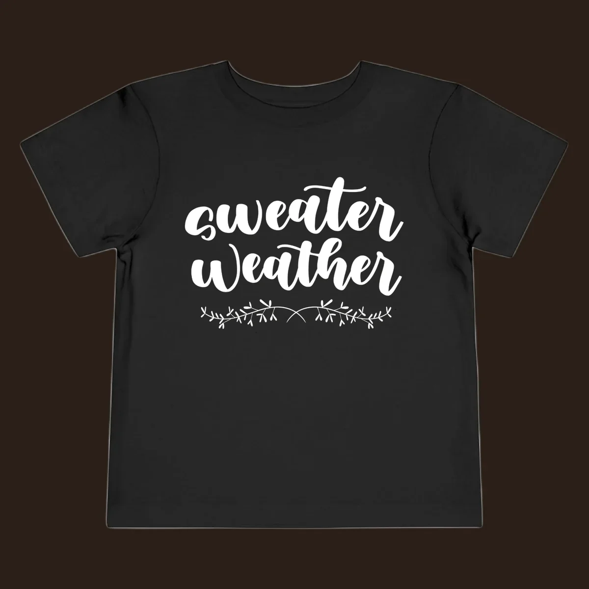 Sweater Weather text in white script font with leafy vine accent.