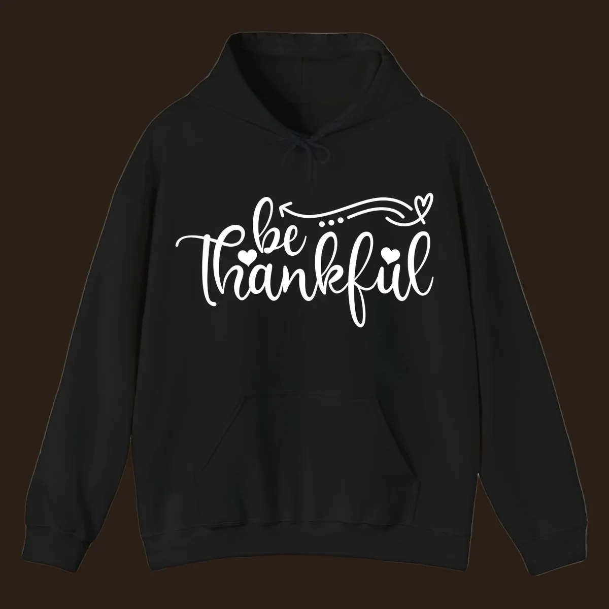 White script text 'be thankful' with hearts and decorative swirls for Thanksgiving.