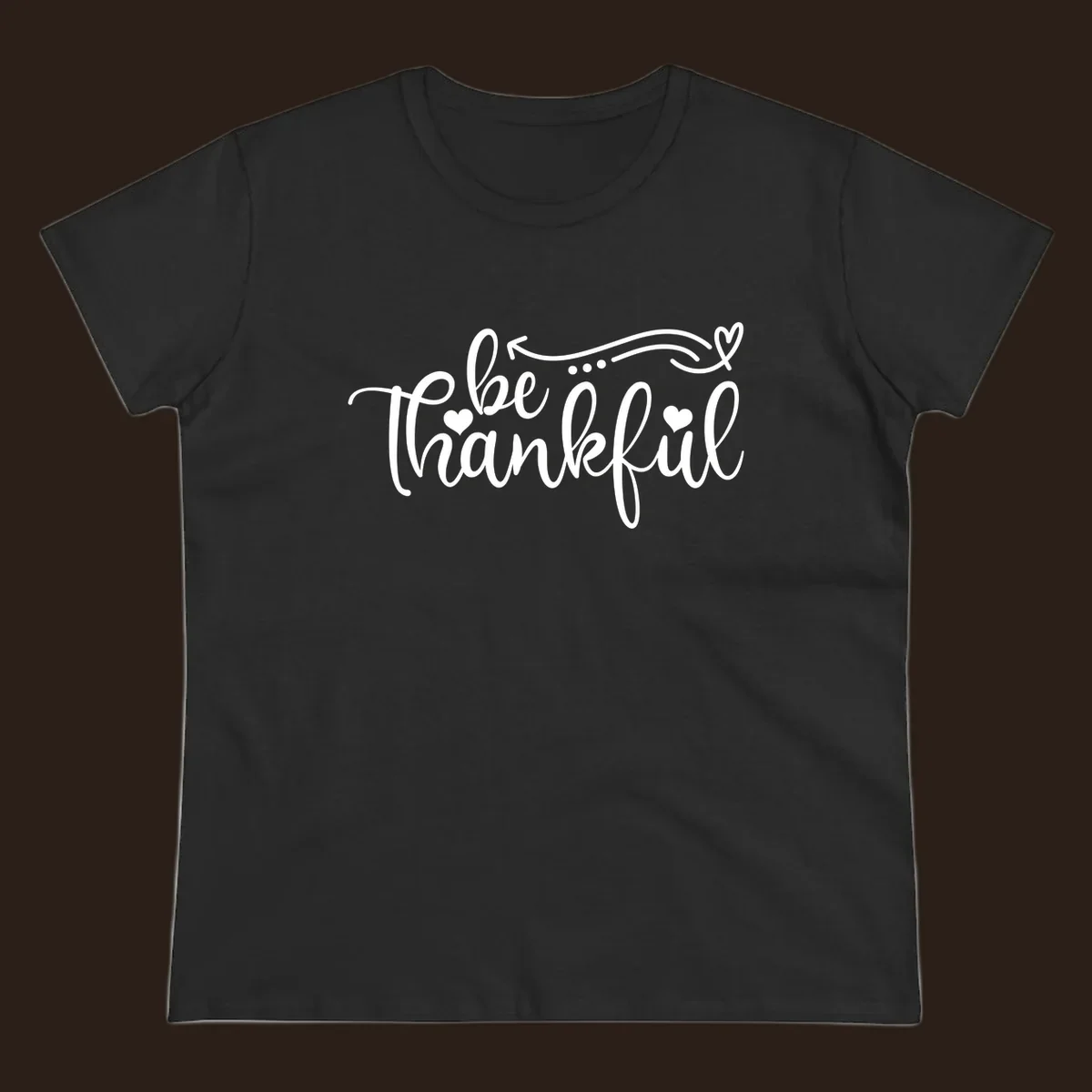 White script text 'be thankful' with hearts and decorative swirls for Thanksgiving.