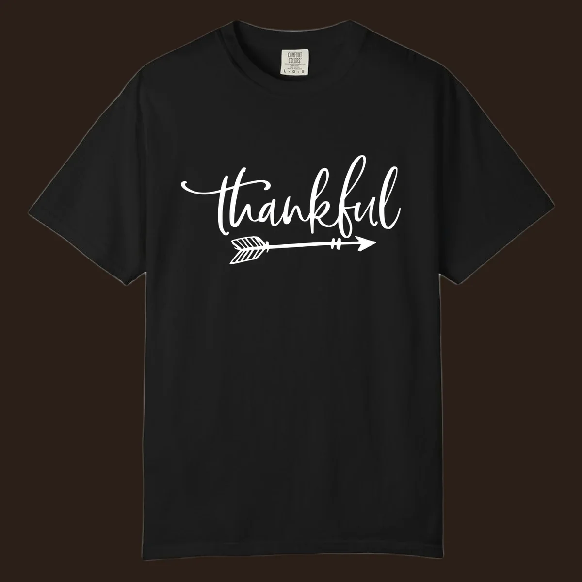 Thankful text with an arrow graphic, Thanksgiving theme.