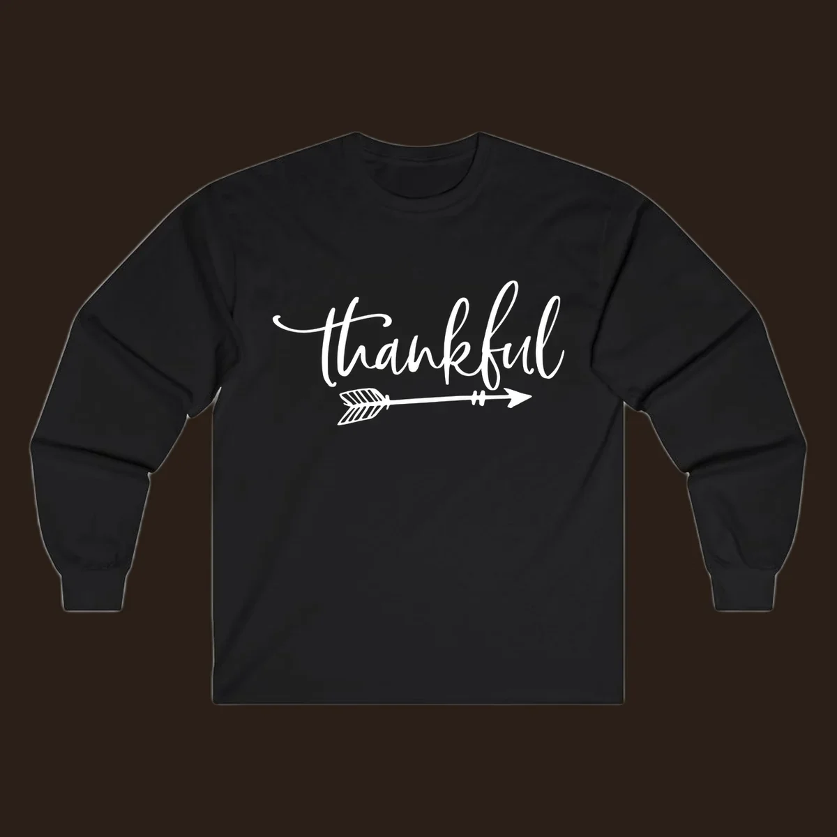 Thankful text with an arrow graphic, Thanksgiving theme.
