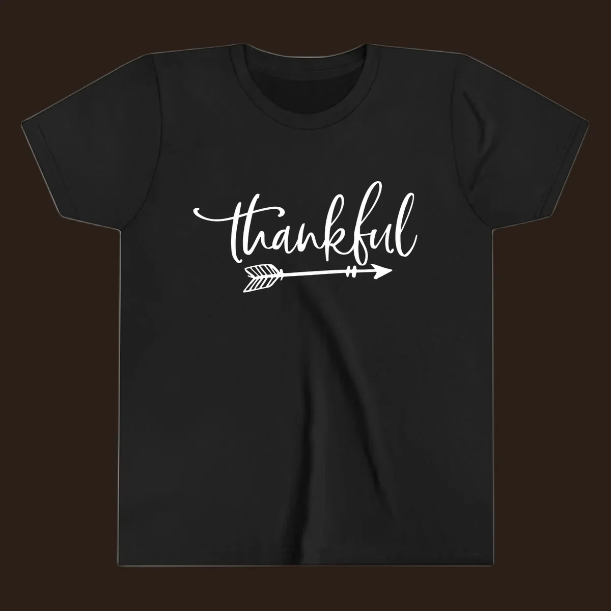 Thankful text with an arrow graphic, Thanksgiving theme.