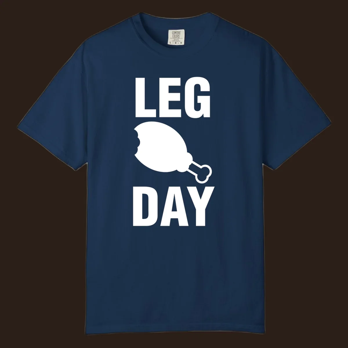 Leg Day text with a bitten chicken leg graphic. Humor fitness design.