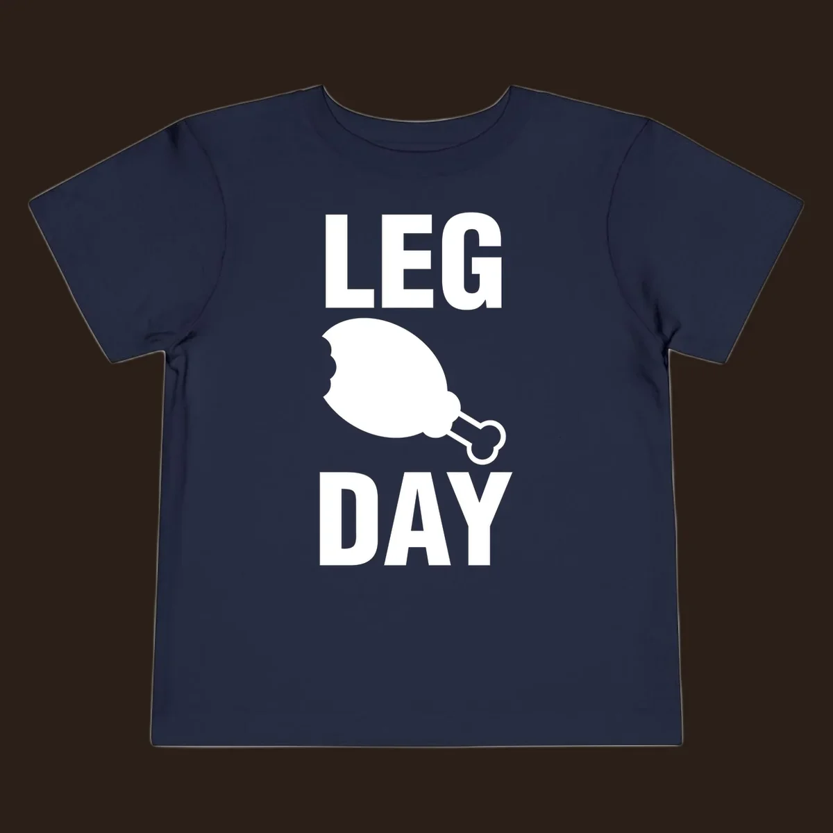 Leg Day text with a bitten chicken leg graphic. Humor fitness design.