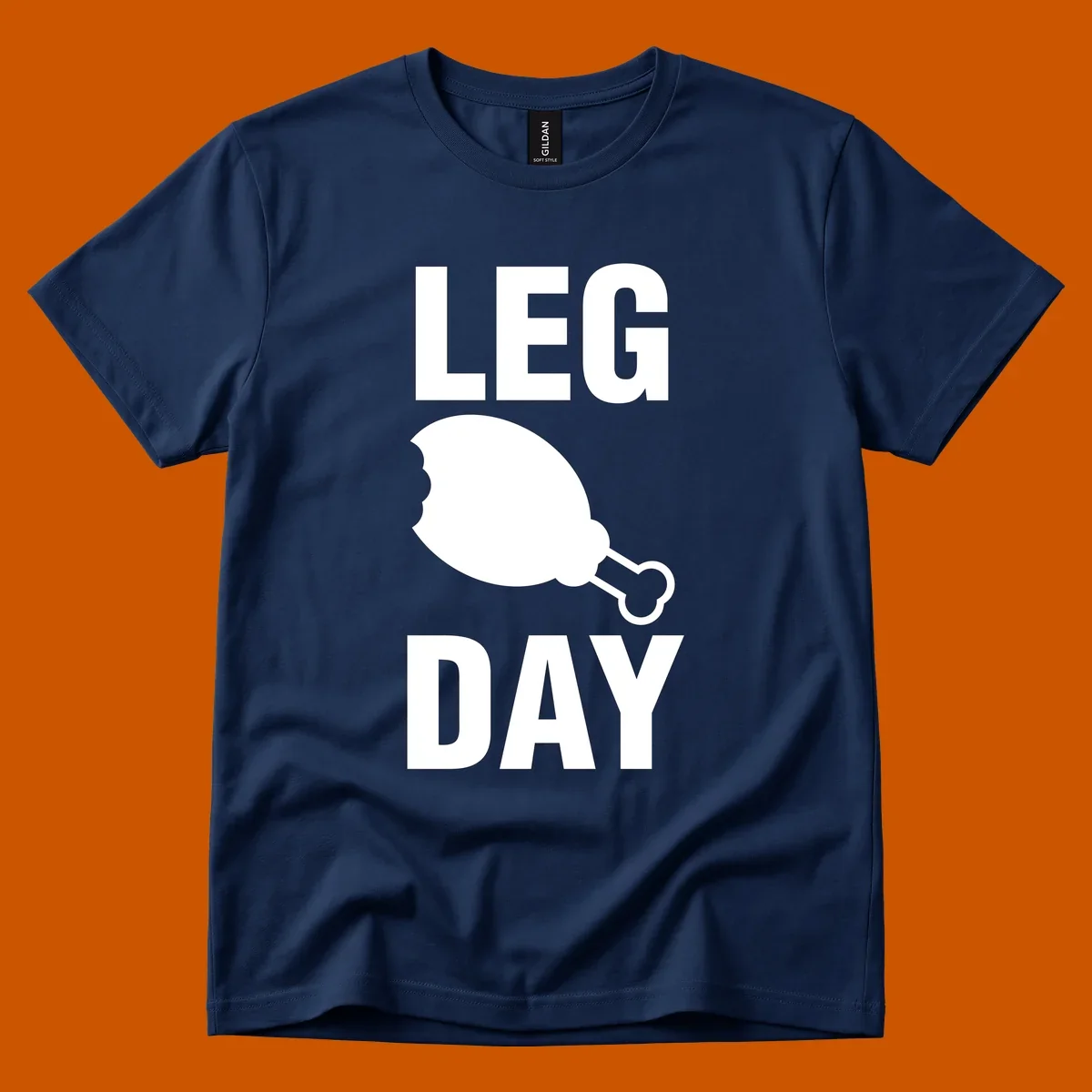 Leg Day text with a bitten chicken leg graphic. Humor fitness design.