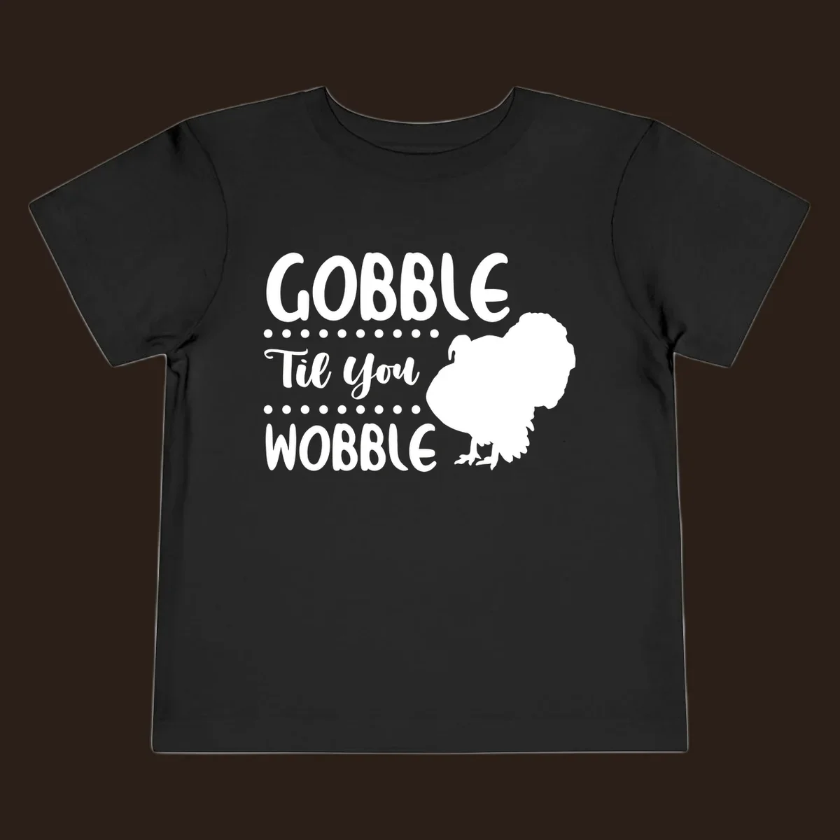 Gobble til you wobble turkey design with text and a turkey silhouette.