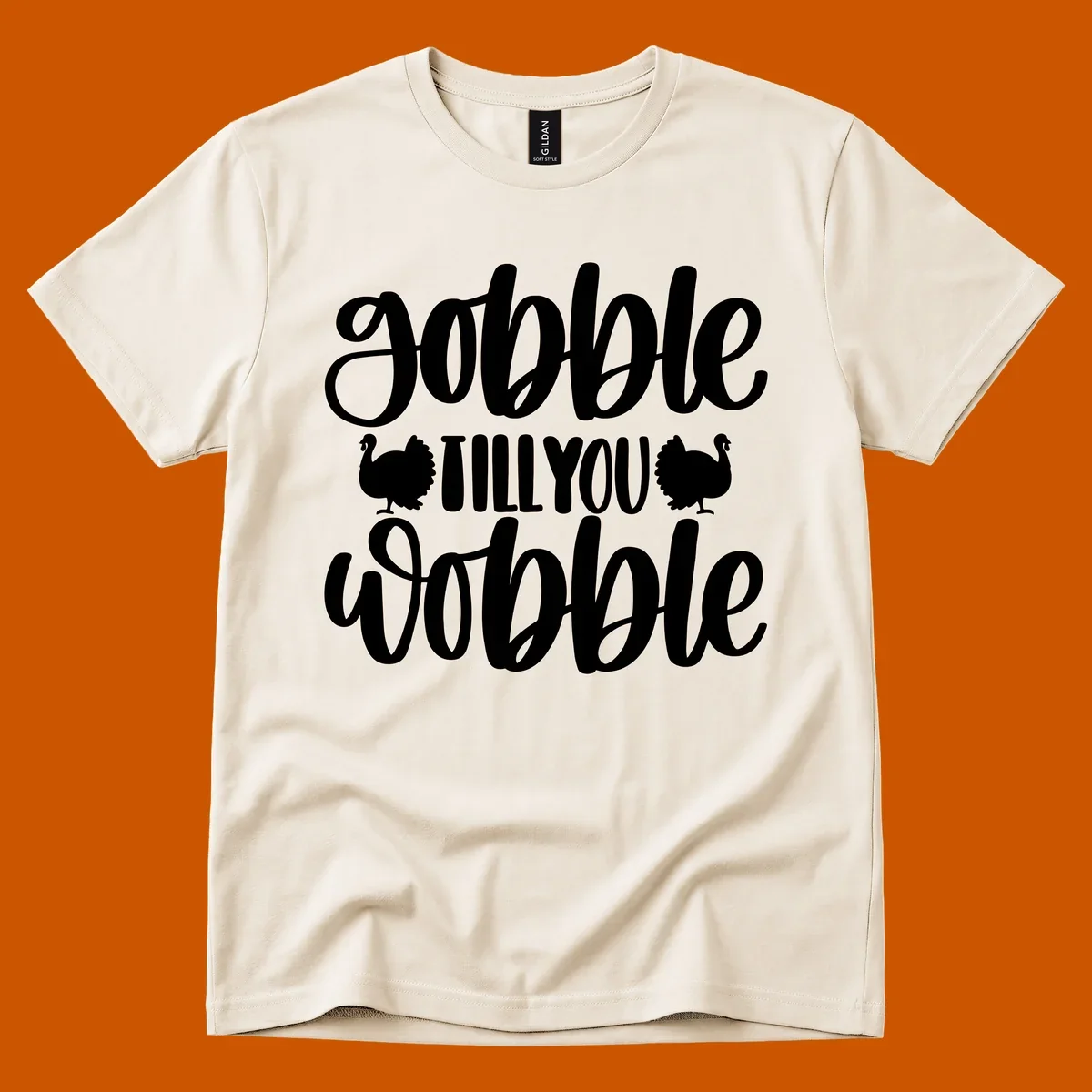 Gobble till you wobble text with turkey illustrations, Thanksgiving design.