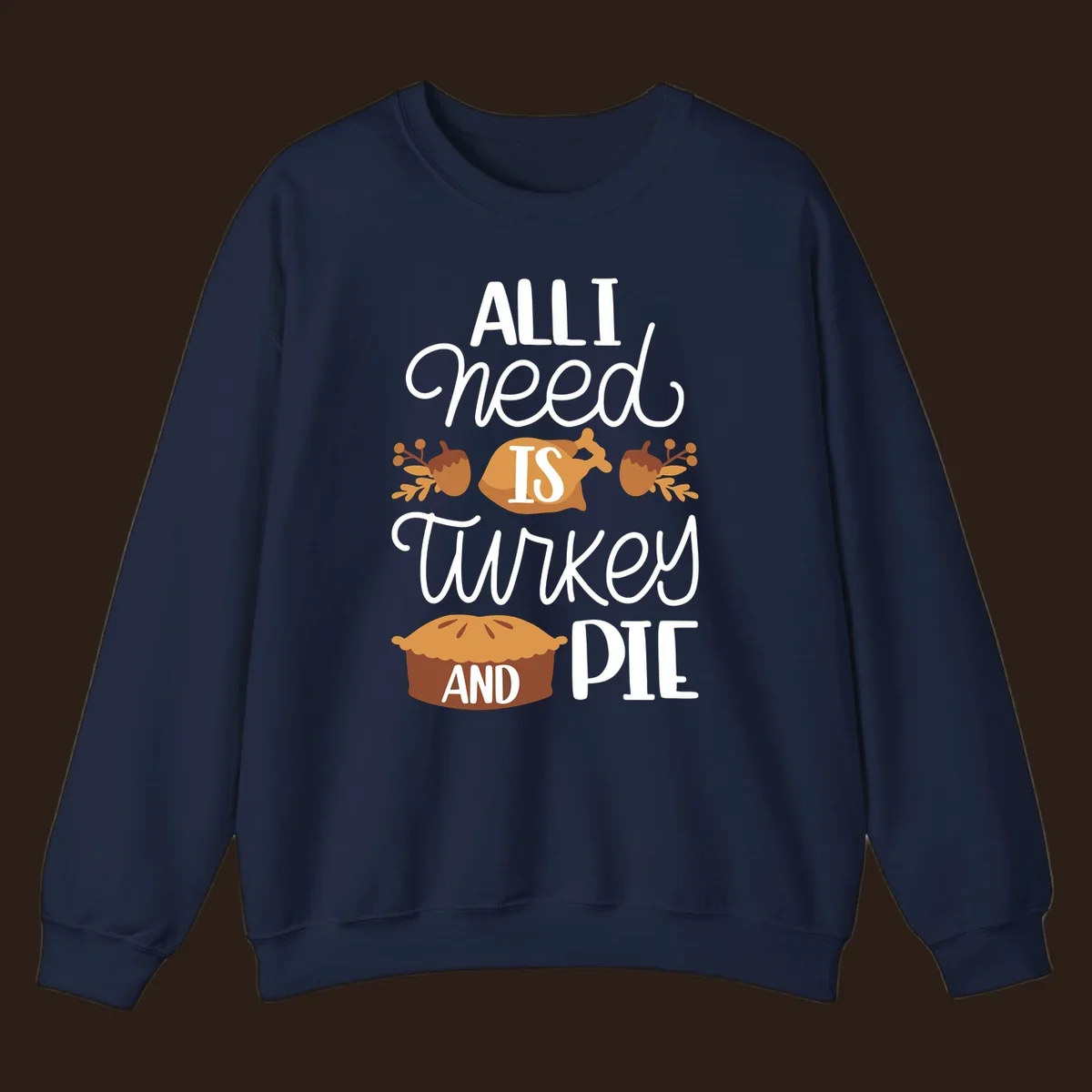 Typography design with illustrations of turkey, pie, and acorns, saying 'ALL I NEED IS TURKEY AND PIE'.