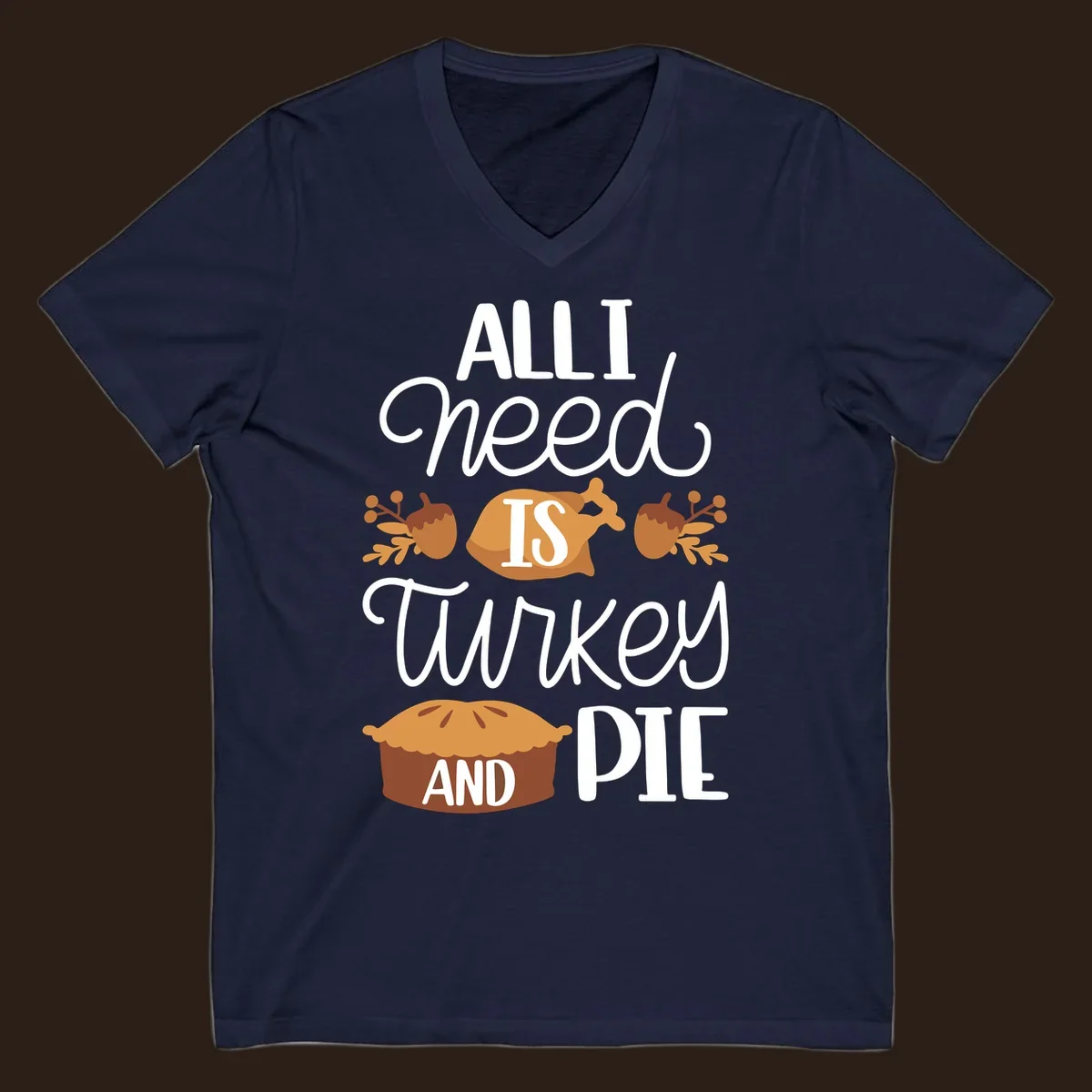 Typography design with illustrations of turkey, pie, and acorns, saying 'ALL I NEED IS TURKEY AND PIE'.