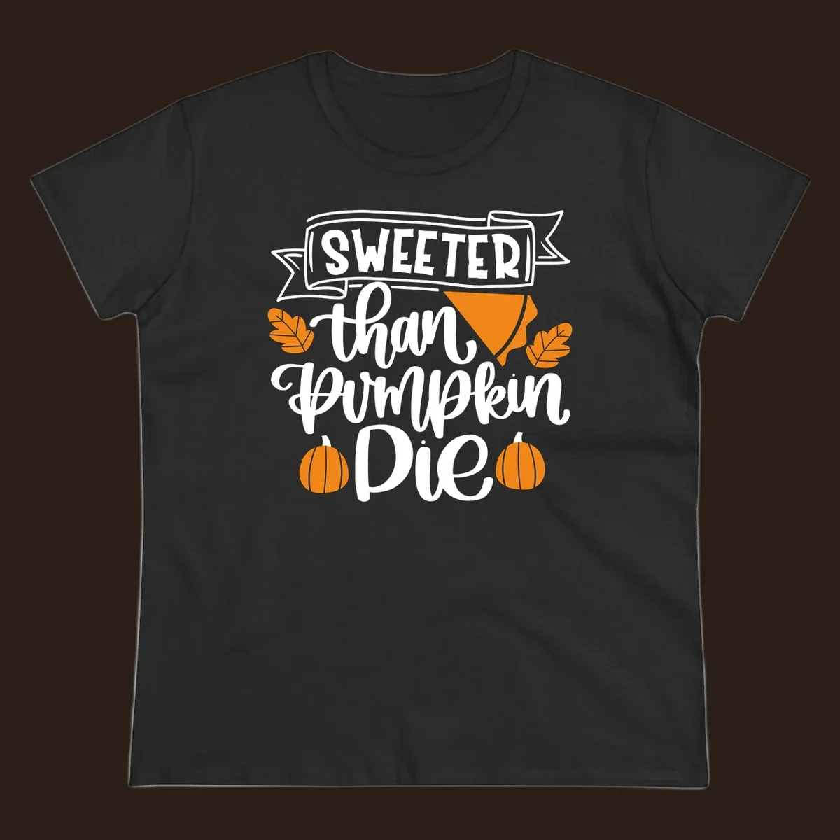 Sweeter than pumpkin pie thanksgiving design with text, pie slice, leaves, and pumpkins.