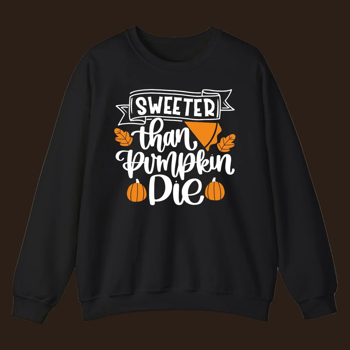 Sweeter than pumpkin pie thanksgiving design with text, pie slice, leaves, and pumpkins.