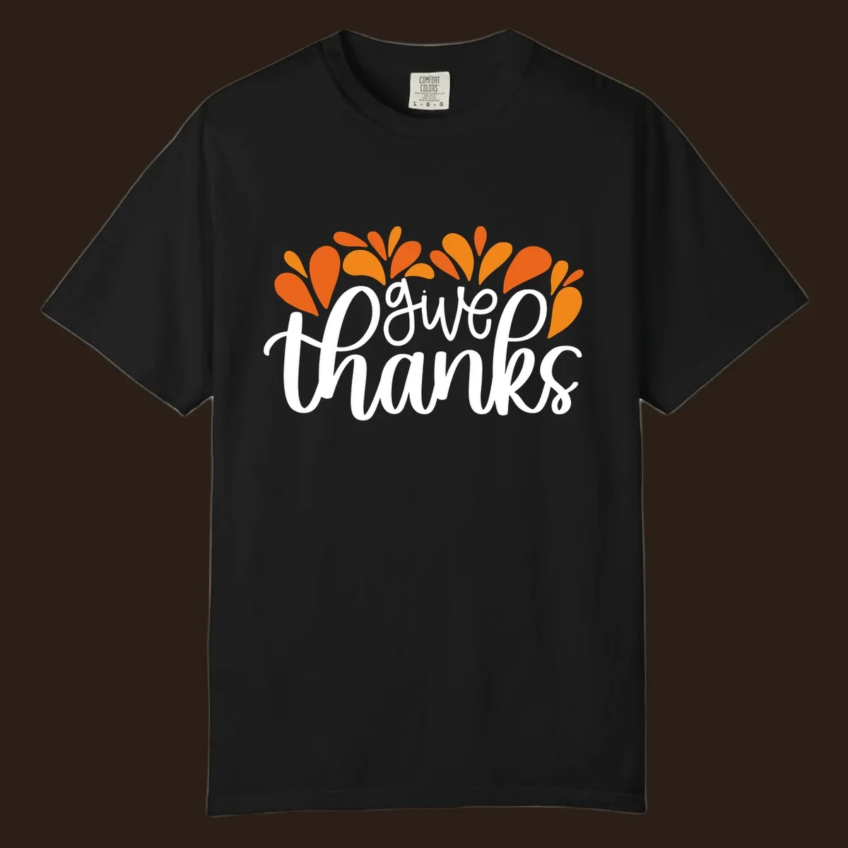 give thanks leaves design with white script text and orange leaf shapes