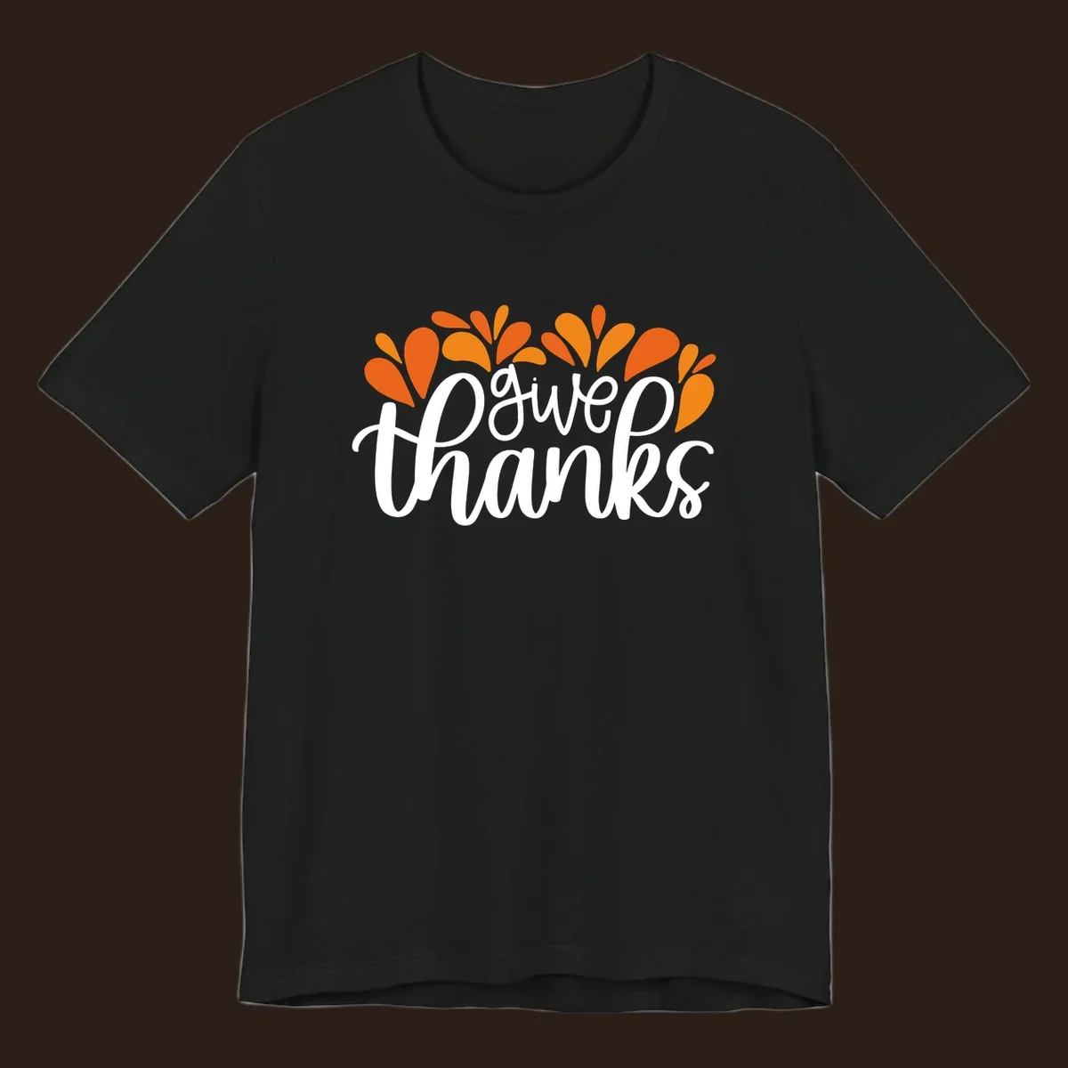 give thanks leaves design with white script text and orange leaf shapes