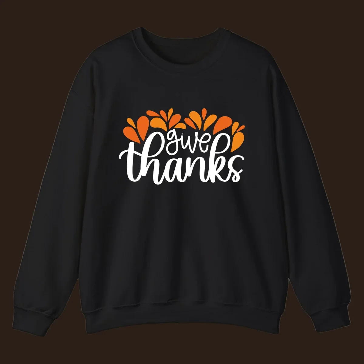 give thanks leaves design with white script text and orange leaf shapes