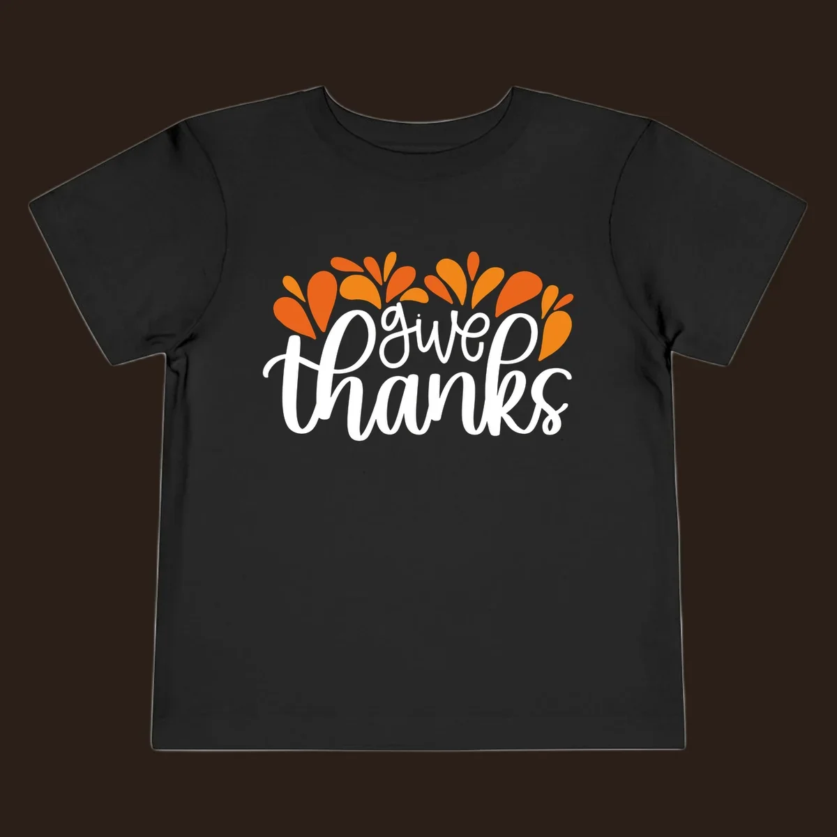give thanks leaves design with white script text and orange leaf shapes