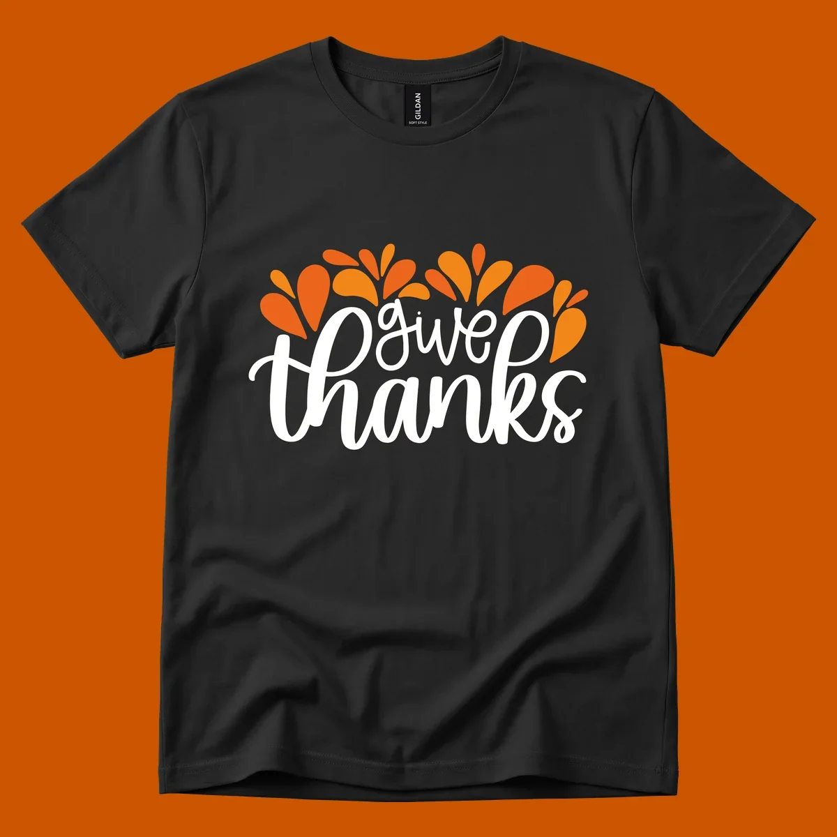 give thanks leaves design with white script text and orange leaf shapes