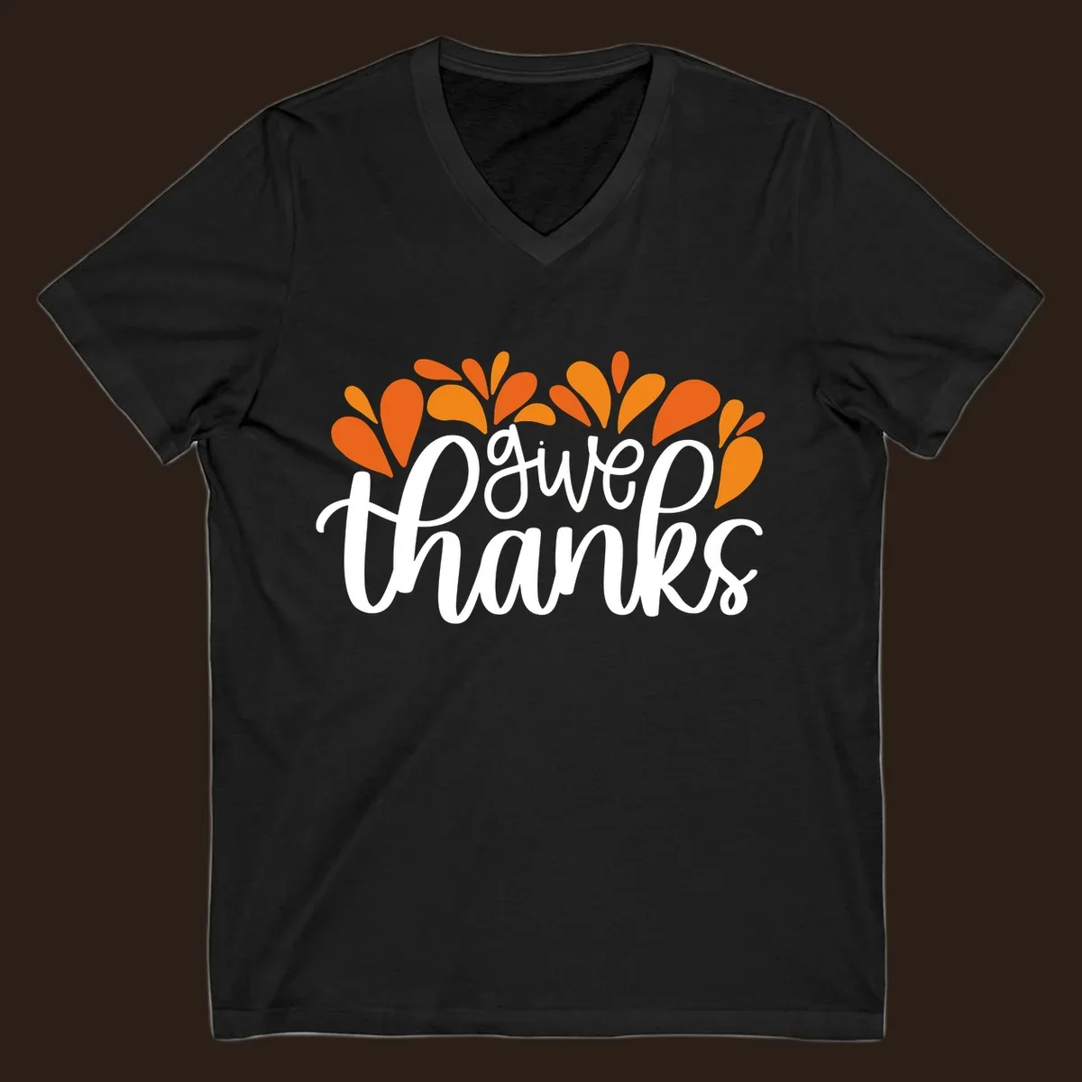 give thanks leaves design with white script text and orange leaf shapes