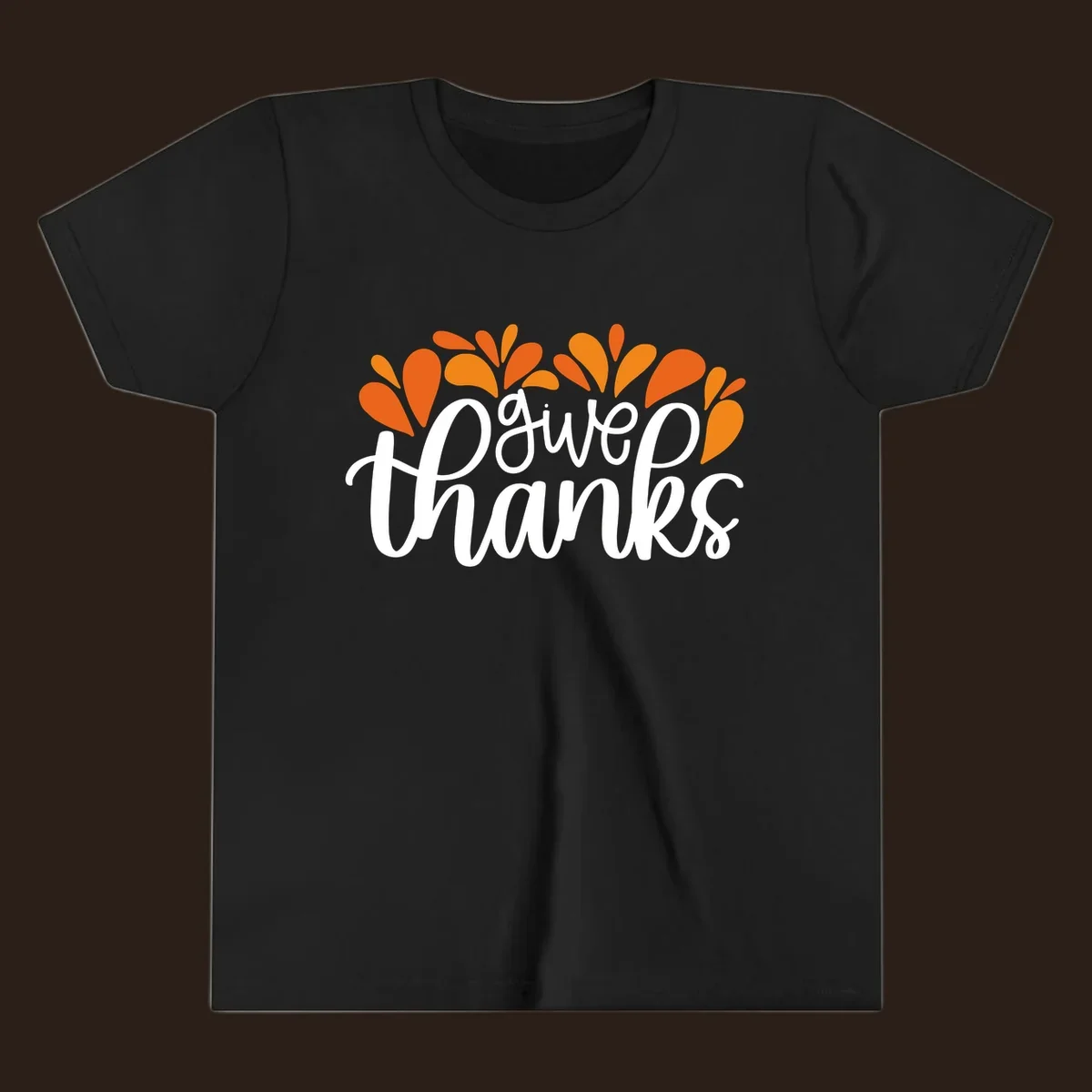 give thanks leaves design with white script text and orange leaf shapes