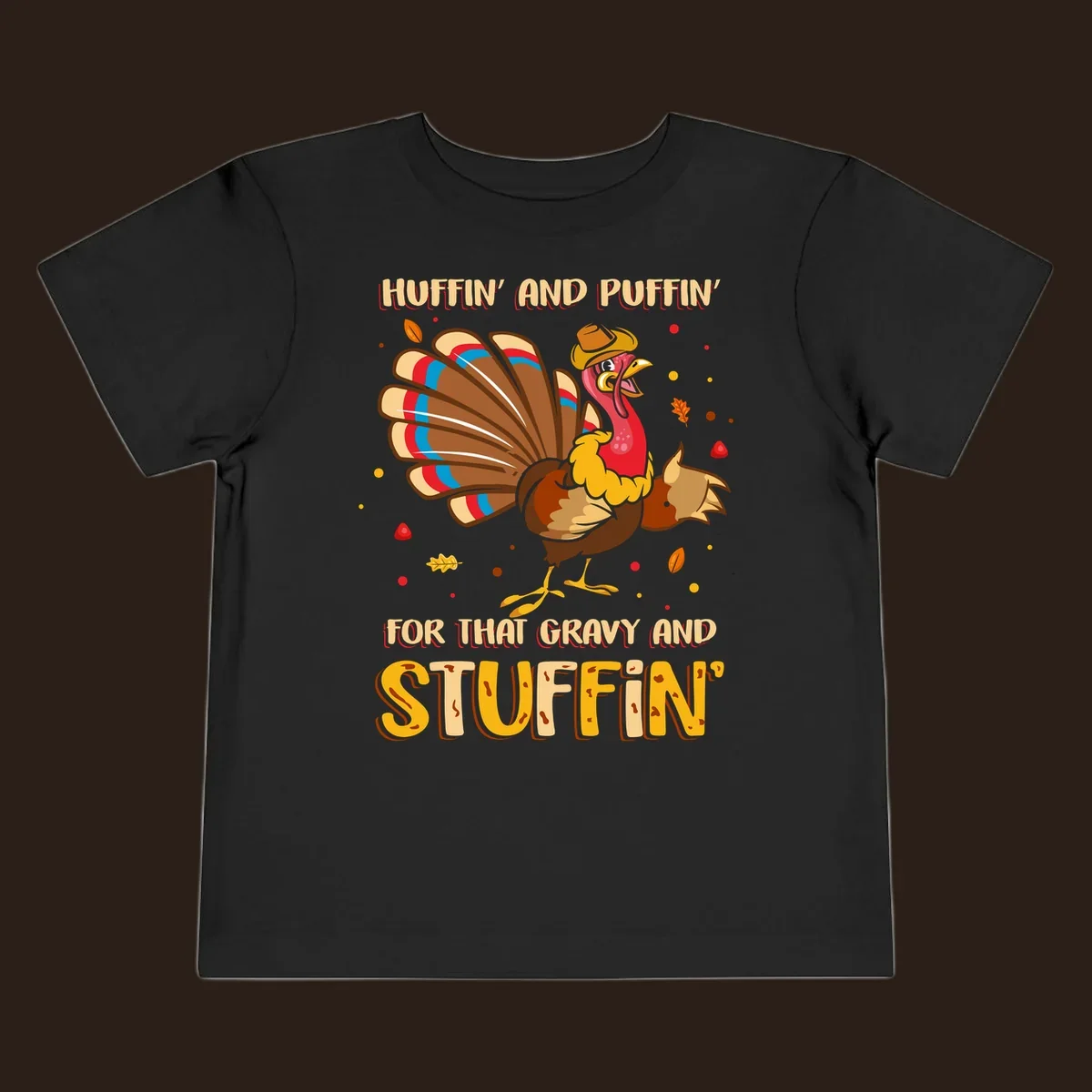 Cartoon turkey with fanned feathers and text 'Huffin And Puffin For Gravy Stuffin'