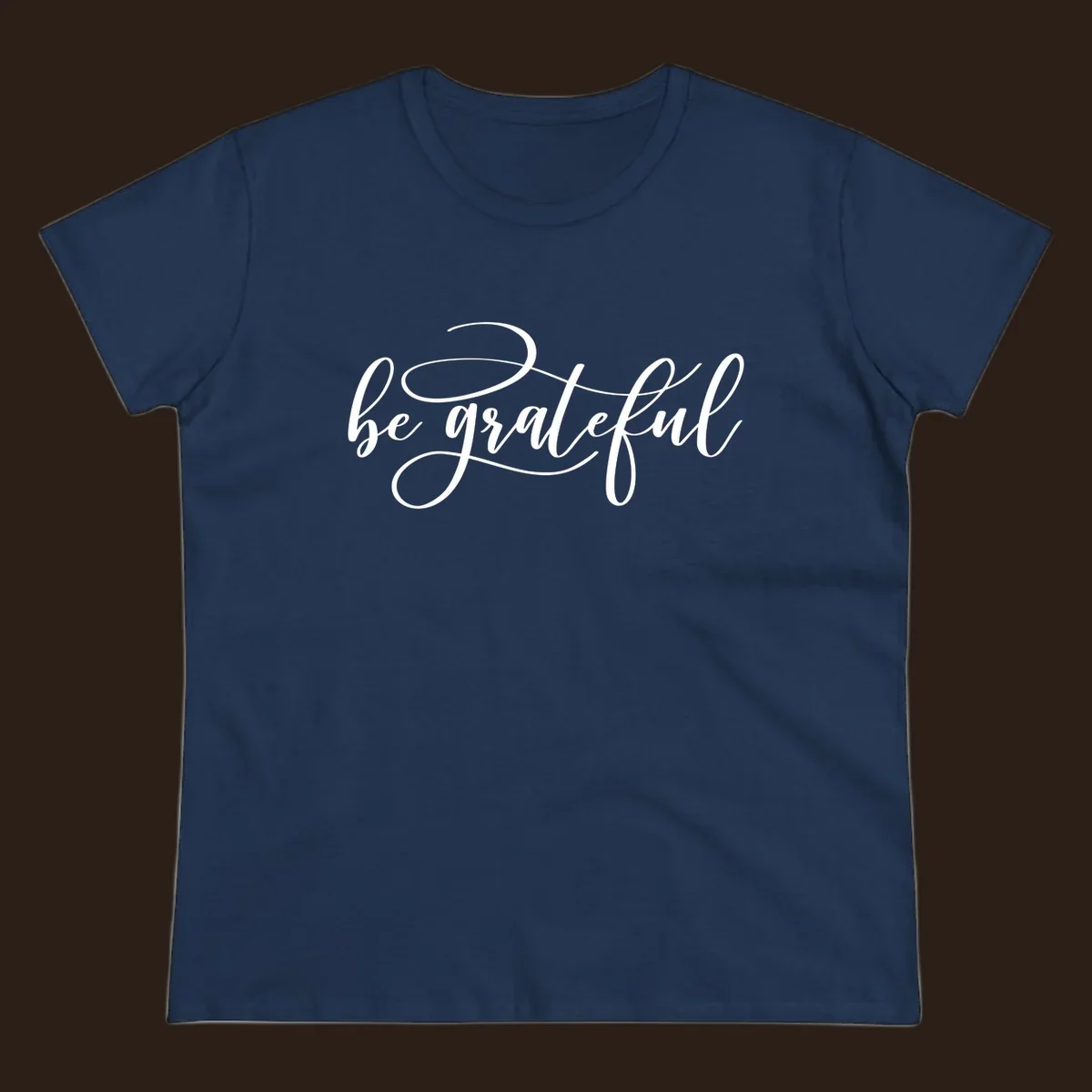 White script text that says 'be grateful' on a black background.