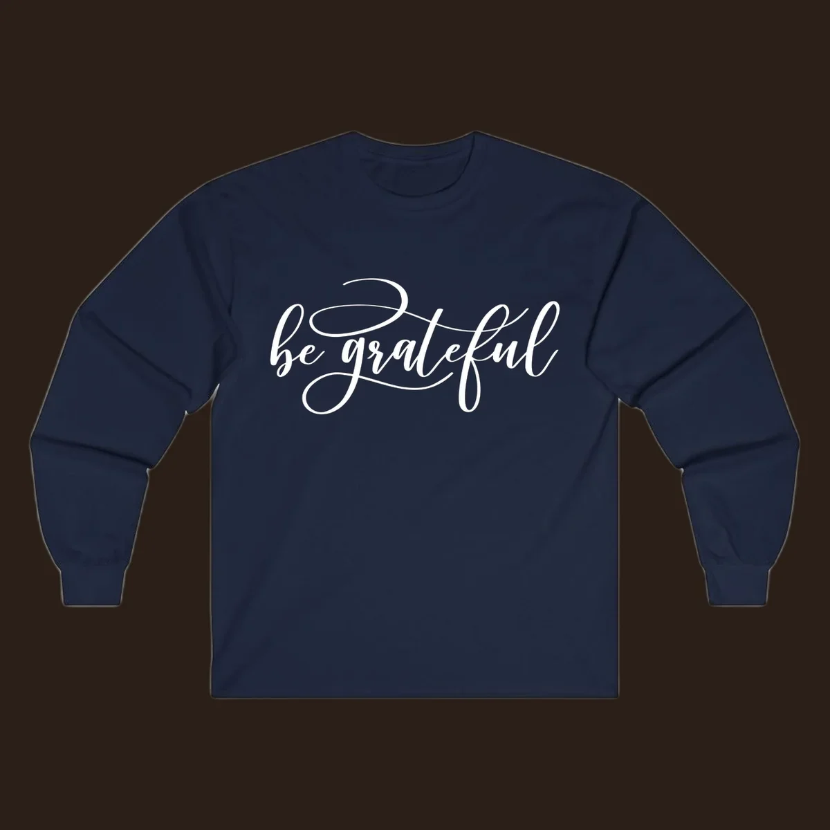 White script text that says 'be grateful' on a black background.