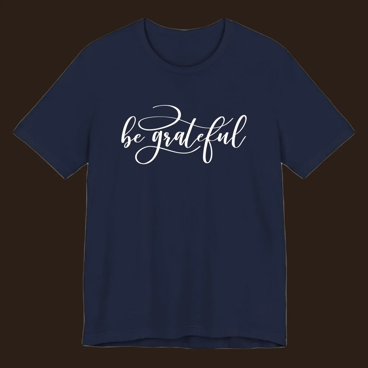 White script text that says 'be grateful' on a black background.