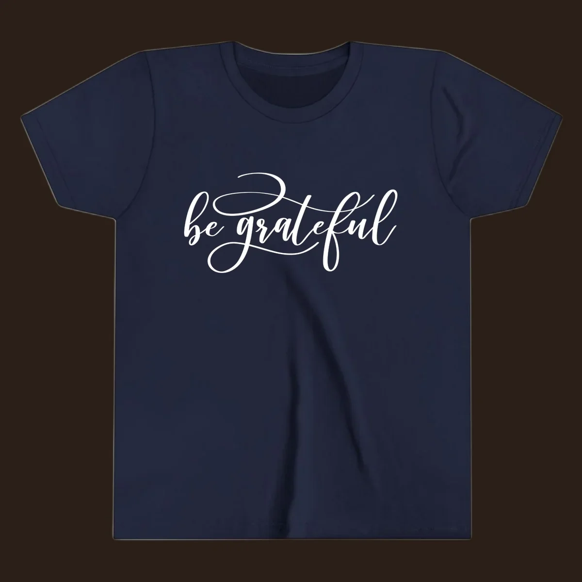 White script text that says 'be grateful' on a black background.