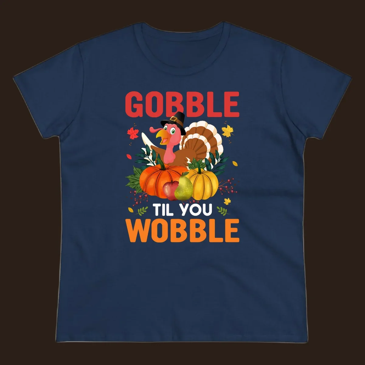 Gobble Til You Wobble Thanksgiving turkey illustration with pumpkins and text.