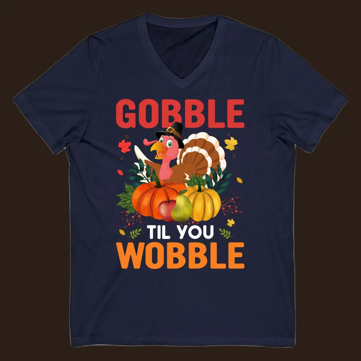 Gobble Til You Wobble Thanksgiving turkey illustration with pumpkins and text.