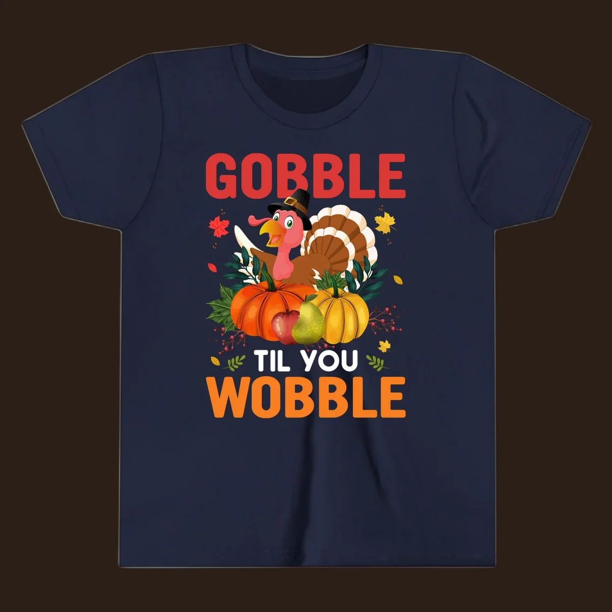 Gobble Til You Wobble Thanksgiving turkey illustration with pumpkins and text.